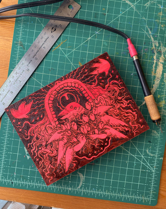 Wood-Burned piece: Raven Halo, Patron Saint